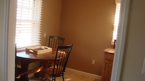 Looking into the kitchen eating area from the living room.