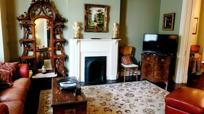 Living Room with leather sofa / chair / ottoman / TV / DVD