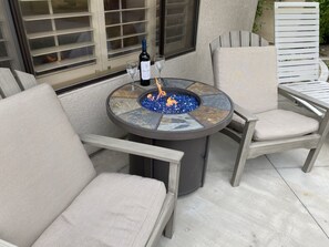 Enjoy a glass of wine by the fire!