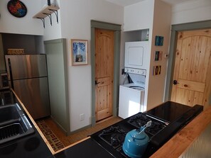 View of Kitchen area and
washer and dryer. 