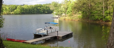 Our dock, the canoe and the pontoon boat available to rent.