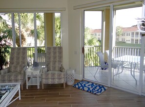 Living room with double wall of sliding glass doors 