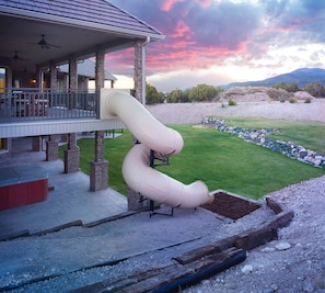 Kid and adult friendly slide and back yard. 