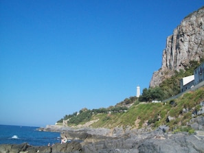 Casa del Faro is located in the stone buildings below the lighthouse.