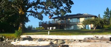 The Frank LLoyd Wright inspired house, with large ocean-view windows and deck