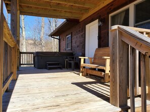 Front porch with hot tub and double slide rocker 