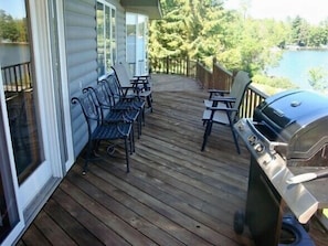 Upper level deck facing the lake directly off of the main dining area