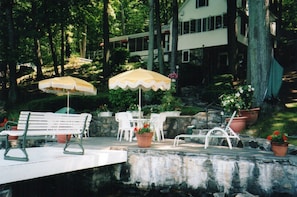 House and patio from lake. (Porch can be seen on left side of house.)