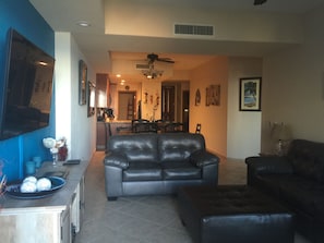 Living Room with comfortable leather love seat and couch