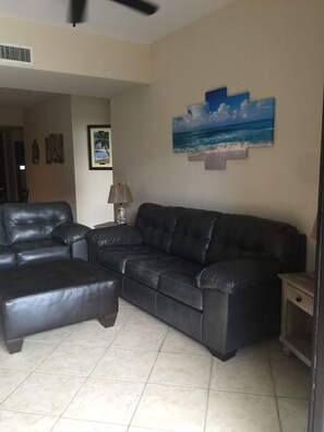 Queen size sofa sleeper in living room with memory foam mattress 