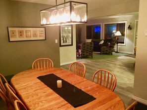 10+ person dining table looking in toward the living room 