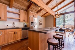 Open kitchen with new appliance and great gathering space.