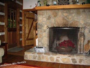 Stunning fireplace,  is the centerpiece of this cabin. 