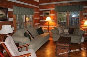 Enjoy the fireplace while relaxing in the living room. 