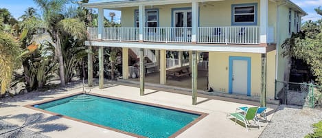 Grill and dining area adjoining poolroom and heated pool.