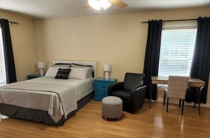 Upstairs bedroom with queen bed, desk, and printer available upon request.