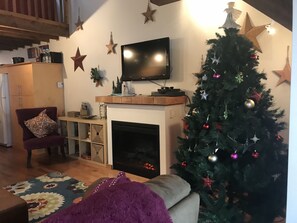 Time to unwind in front of the fire.... ( electric fireplace).
Christmas view