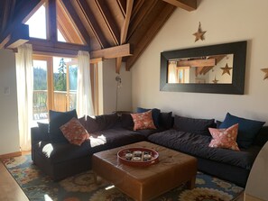 Main sitting area that leads to front deck and oversees Strathcona Park.
