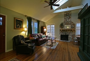 vaulted living area with skylights, french doors to patio and grille
