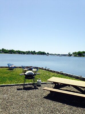 Picnic area with fire pit in background 