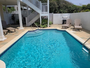 Private pool area with grill