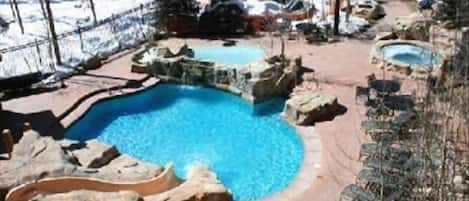 Year round heated pool, slide, 2 hot tubs and kiddie pool.