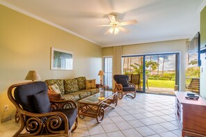 Spacious living room area with open views from the patio doors to the lanai