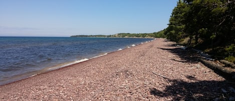 Pebble beach in front of home.  Looking east on Great Sand Bay.