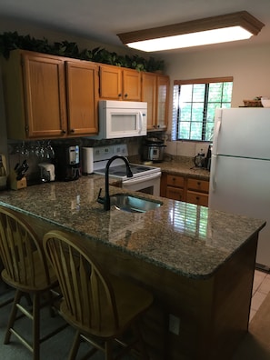 Kitchen w/ granite countertops