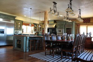 CUSTOM KITCHEN DINING  W/ FRENCH DOORS LEADING OUT TO WRAP AROUND DECK & BBQ!