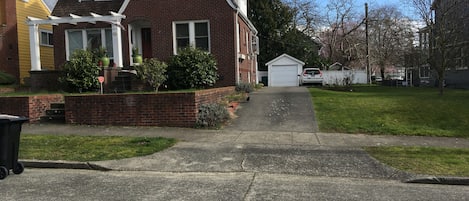 Front of house with driveway for off street parking.