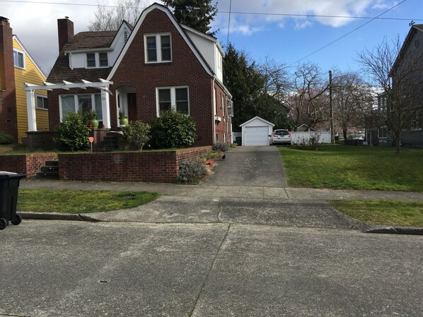 Front of house with driveway for off street parking.