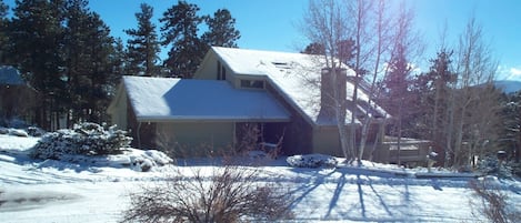 Front winter view of Evergreen Home on cul-de-sac