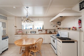 Good-sized kitchen adjoins dining room and overlooks mountains.