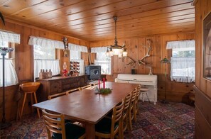 Enjoy family gatherings around this 12 person table, adjoining the kitchen