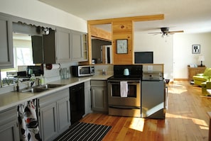 Full kitchen opens to the living area and has gorgeous views of the lake 