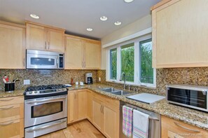 Fully Stocked Gourmet Kitchen.