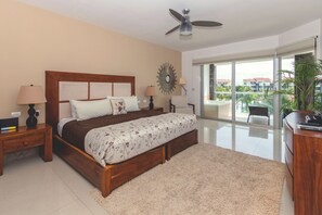 Master suite with king bed, TV and ocean view
