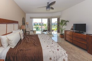 Master suite with king bed, TV and ocean view
