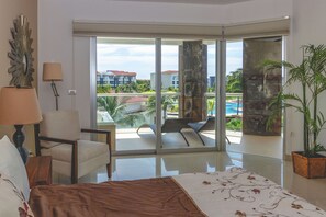 Master suite with king bed, TV and ocean view
