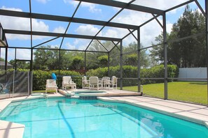 Pool and Spa, heated, extra seating,shows hedge & fence to neighbor  for privacy