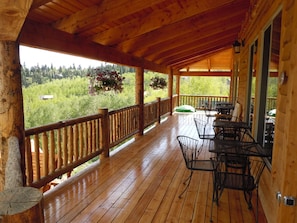 Spacious deck surrounds entire cabin. Tables & chairs for 40 people on the deck.