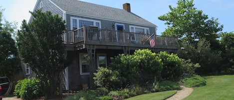 View of house from driveway that has room for several cars