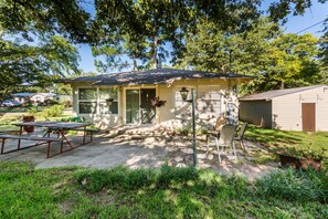 Large shady back patio with charcoal grill and smoker.