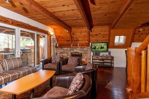 Open living room with LCD TV and Romantic Fireplace