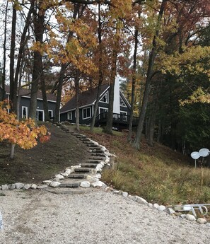 View of house from the lake in the fall.