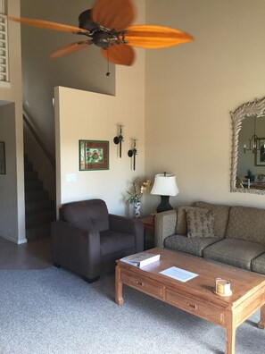 Comfortable living room includes HD-TV and access to the main lanai.