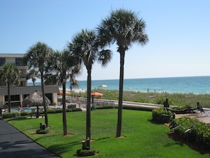 View of clubhouse, pool and lawn from balcony