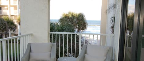 We have a great ocean view from our large porch with comfortable seating for 4!