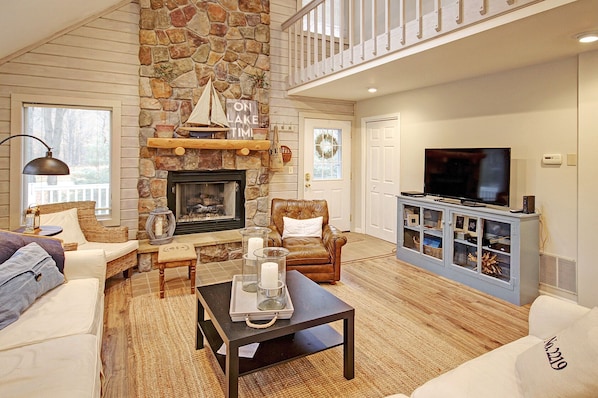 great room with gas fireplace, sliding doors to deck